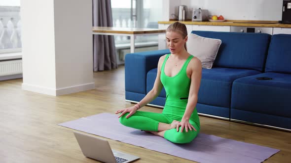 Woman in Sportswear Talk on Video Call Sit on Yoga Mat