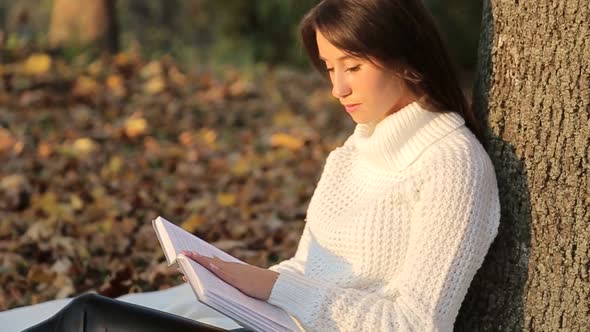 Girl Reading a Book in Park Woman Green