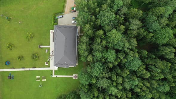 Top View of the Wedding Venue in a Green Field and a House in the Forest. Wedding Ceremony with