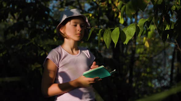 Pretty Children Girl Naturalist Scientist Explores Plant and Insect Life Take Notes His Notebook