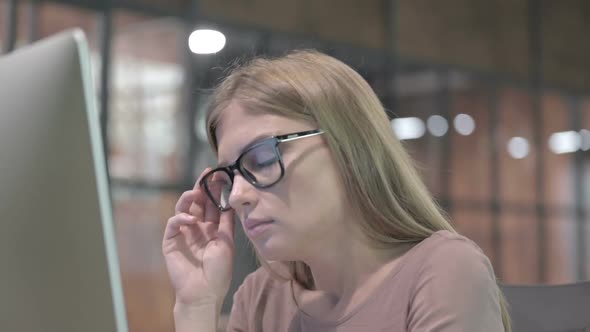 Portrait Shoot of Tired Woman Having Quick Nap at Office