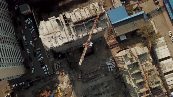 Top View Zoom Out of Construction Site During Work Hours