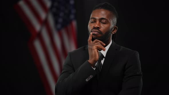 Troubled Thoughtful African American Elegant Man in Suit Waiting for Public Speaking at Black