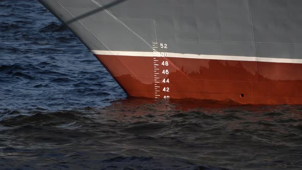 Bow of the Ship in the Water with a Measuring Scale