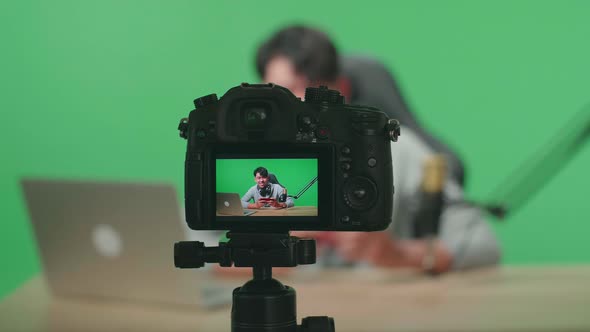 Camera Monitor Recording Man Gamer Looking At Camera While Playing Mobile Phone Game On Green Screen