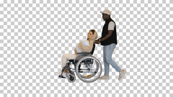 African American husband pushing a wheelchair, Alpha Channel