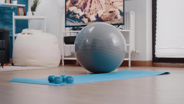 Empty Living Room with Sport Training Equipment on Floor