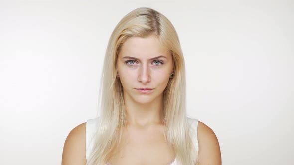 Portrait of Angry Blond Woman Feeling Upset Displeasure Looking Strictly at Camera Isolated Over