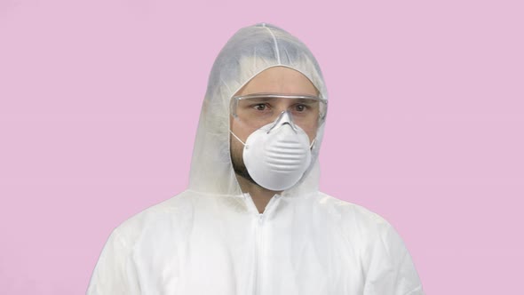 Portrait of Sad Young Man in Antiviral Protective Clothing