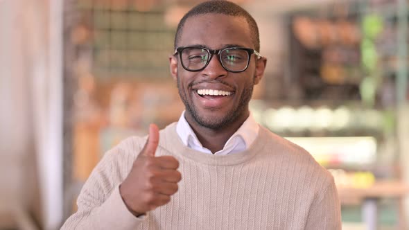 Portrait of Positive African Man Doing Thumbs Up 