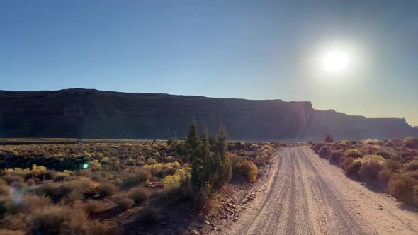 Driving past the rock formations of the Valley of the Gods