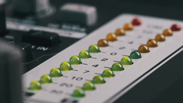 Macro Shot of Stereo LED Indicator on Mixing Console with Pulsating Sound Level