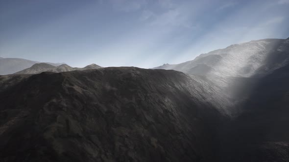 Sun Rays Against the Backdrop of the Mountains