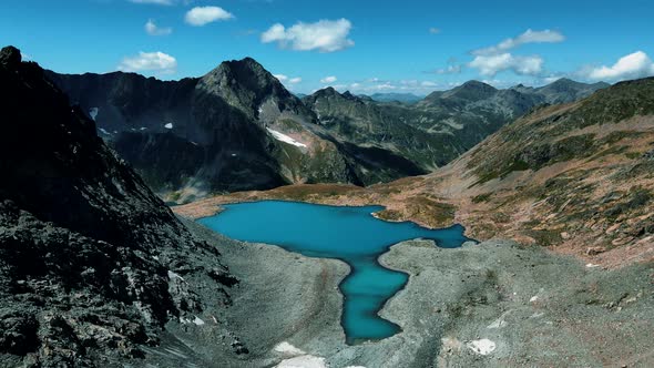 Alpine blue lake at the top of the ridge.