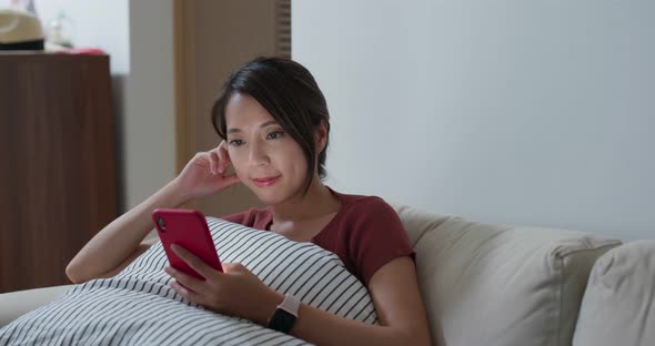 Woman use of smart phone for online at home