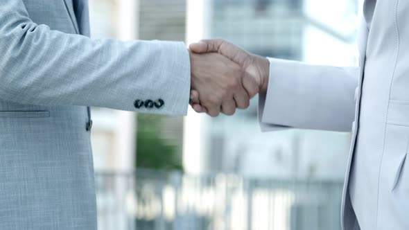 African American Business Partners Shaking Hands Outdoor