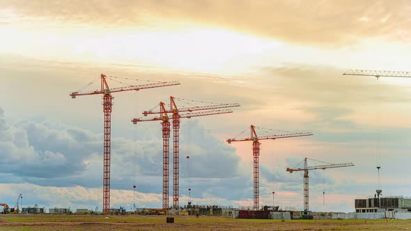 Tower Cranes Operate on City Construction Site Timelapse