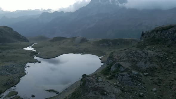 Bird's Eye View Over the Receding Water Level of Lake Ayous During Autumn Season in the Pyrenees in