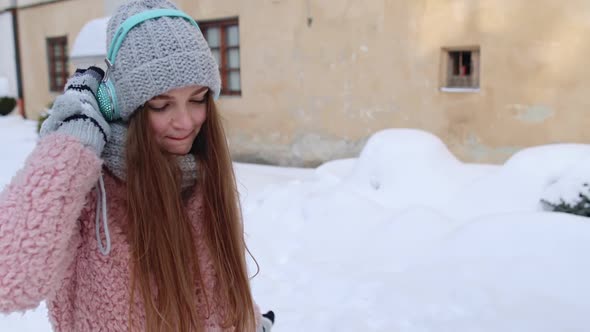 Girl Tourist During Her Vacation Listening to Music Via Headphones and Dancing in Old City Center