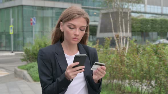 Young Businesswoman Making Online Payment on Smartphone