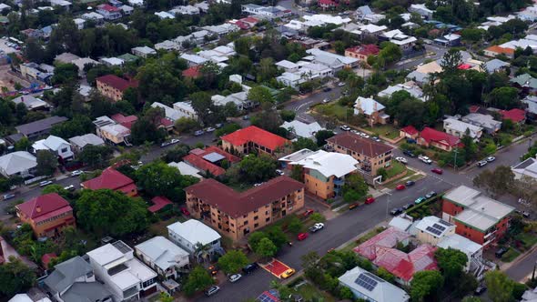 Aerial View Of Suburban Houses Near City Skyline Of Brisbane In Queensland, Australia. tilt-up revea