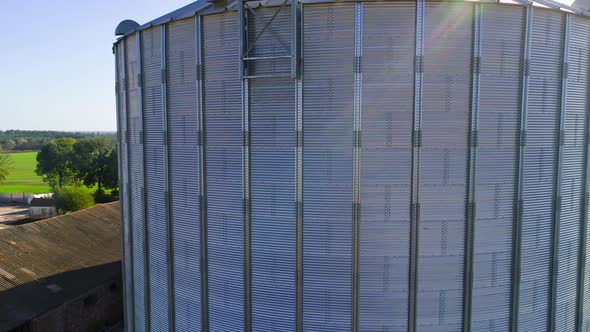 Granary grain elevators. Metal tanks for the storage crop. Large bins for farming.