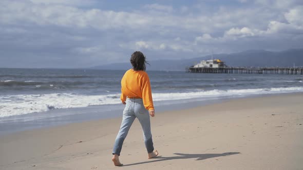 Happy girl on the beach in California