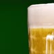 Close up of beer glass on green background - VideoHive Item for Sale