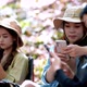 Group of girl friends with smartphone while camping in park - VideoHive Item for Sale