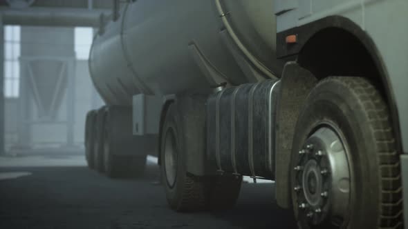 Large White Cistern Trucks in a Factory alt