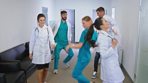 In a Modern Hospital Corridor Dancing Excited