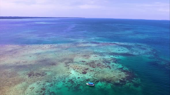 Boat Sailing on Pristine Crystal Caribbean Waters