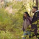 Out Focus Young Couple Hikers Travel with Backpack Walking in Forest Talking Discussing Correct - VideoHive Item for Sale