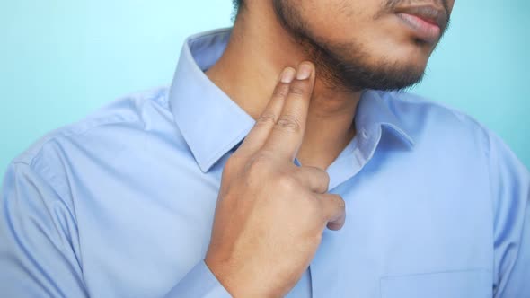 Unrecognized Man Touching His Neck To Control Blood Pressure
