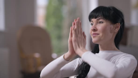 Calm Confident Slim Woman Meditating at Home Closing Eyes in Slow Motion