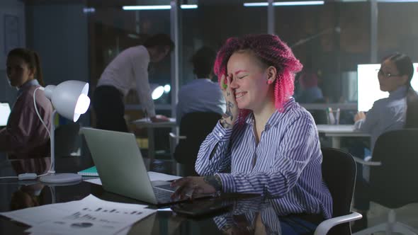 Portrait of Happy Leasbian Office Employee Look at Laptop and Laugh Working Late with Colleagues