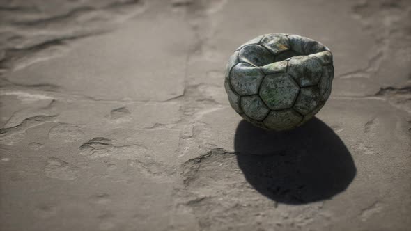 Old Soccer Ball the Cement Floor