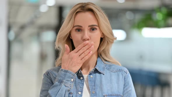 Beautiful Young Woman Giving Flying Kiss