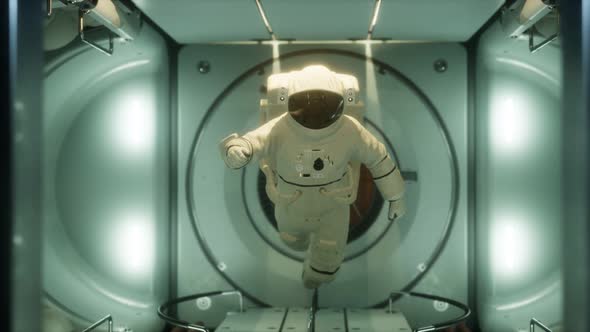 Astronaut Inside the Orbital Space Station