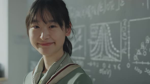 Portrait of Asian College Girl in Classroom