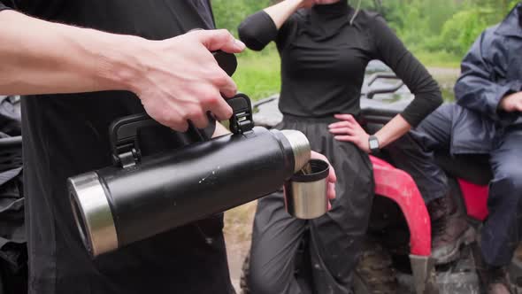 Quad Bike Riders Resting after Driving in Forest