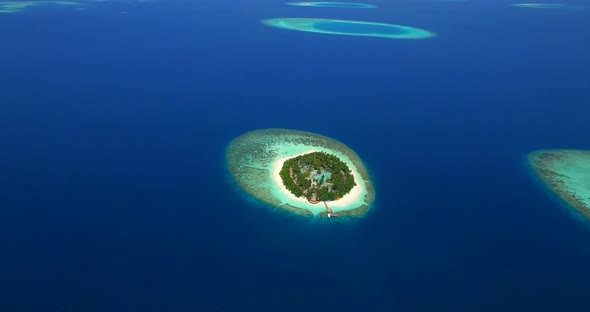 Aerial drone view of scenic tropical islands in the Maldives.