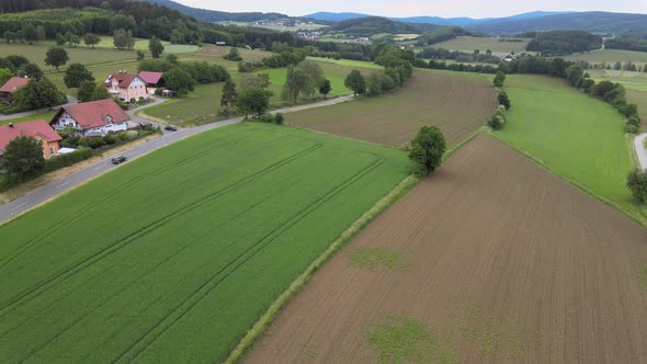 Rural Agricultural Landscape For Farming, Fields end Forest - Aerial Drone Footage