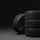 four summer car tires rotating above a dark background - VideoHive Item for Sale