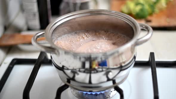 Green buckwheat boiling on fire