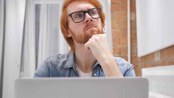 Thinking Sad Young Man at Work