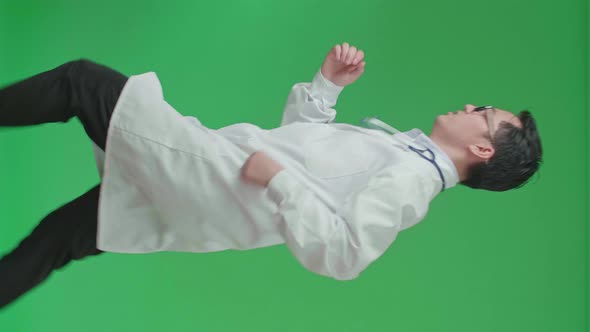 The Side View Of Asian Doctor With Stethoscope Running On Green Screen Chroma Key