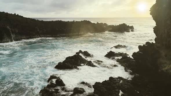 The Rocky Coast of Easter Island at Sunset.