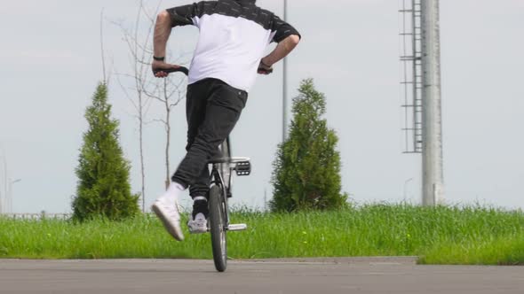 BMX Flatland Bicycle Rider Performing a Trick Pedaling Time Machine No Hand