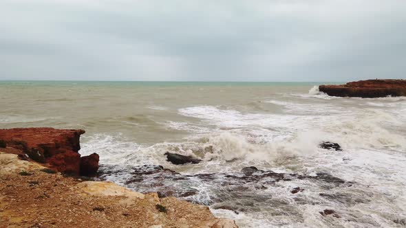 Sea Waves From Strong Wind Crashing Against the Rock Shore.